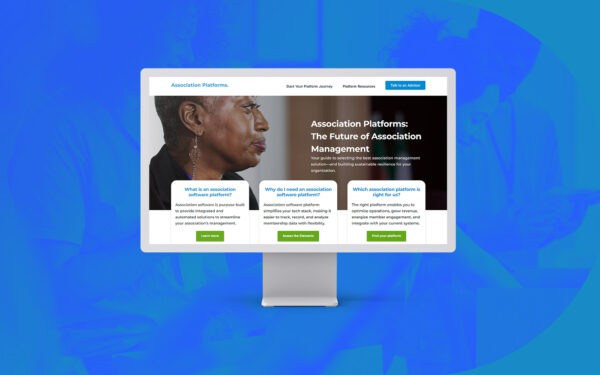 A monitor displays the Togetherwork website homepage, focused on association platforms and management solutions.