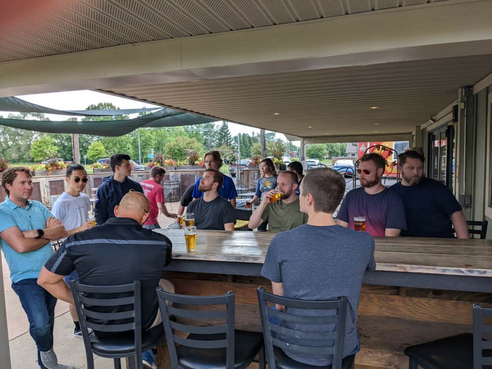 People sitting around brewery