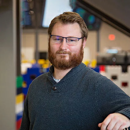 man with beard and glasses