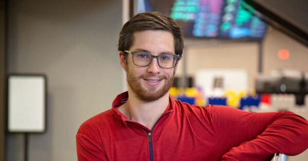 Guy with glasses in red shirt