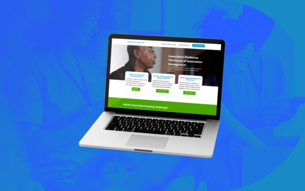 A tilted laptop displays the Togetherwork website homepage, focused on association platforms and management solutions. The screen highlights informational cards and a green banner against a bright blue background with a faint overlay of people collaborating.