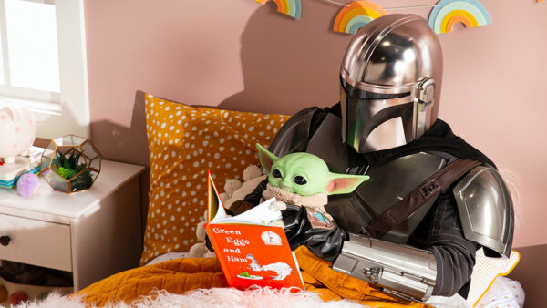 The Mandalorian and Grogu in bed reading Green Eggs and Ham.