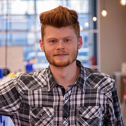 Close up of guy in plaid shirt