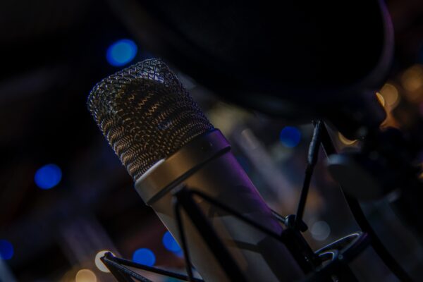 microphone with blurred blue and black background