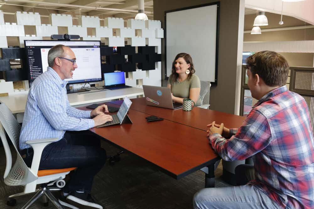 Group of people sitting around a table for a meeting at BizStream