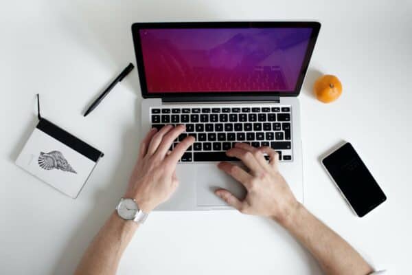 Person typing on a laptop