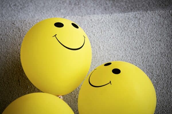 Balloons with smiley faces on them