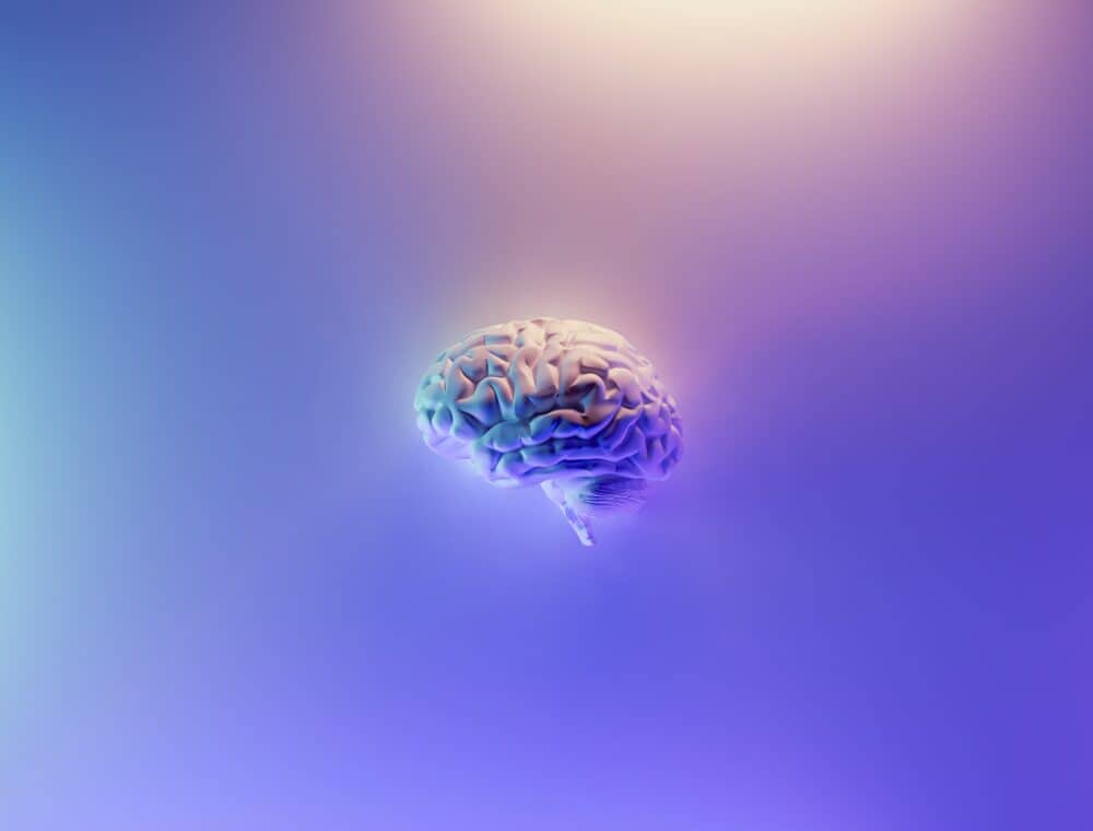 Artistic image of a brain with pink and purple gradients