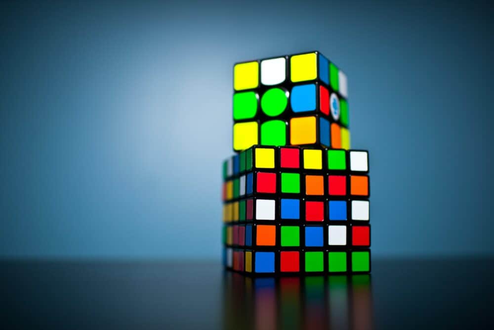 A Rubik cube sitting on top of a table photo