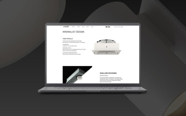 Lucifer Lighting website shown on a laptop with a black and gray background