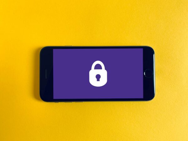 Phone shown a lock on the screen on yellow background