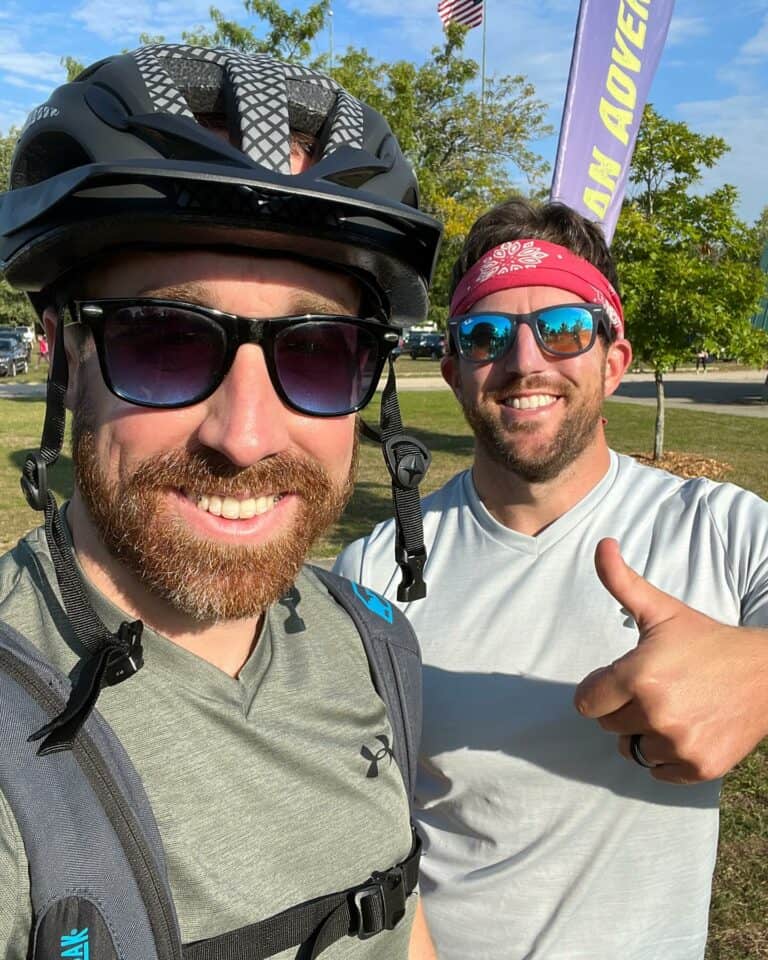 Two men giving a thumbs up