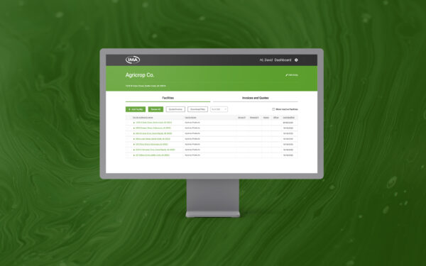 IMA Financial Group, Inc. website shown on monitor with green textured background