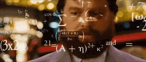Bearded man with math equations floating around him