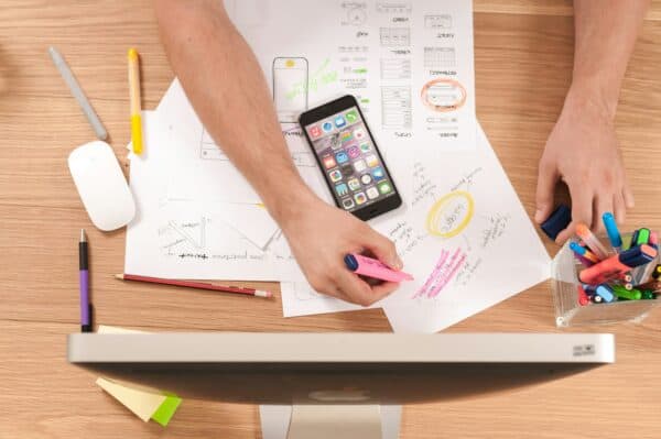 Papers being written on, on a desk