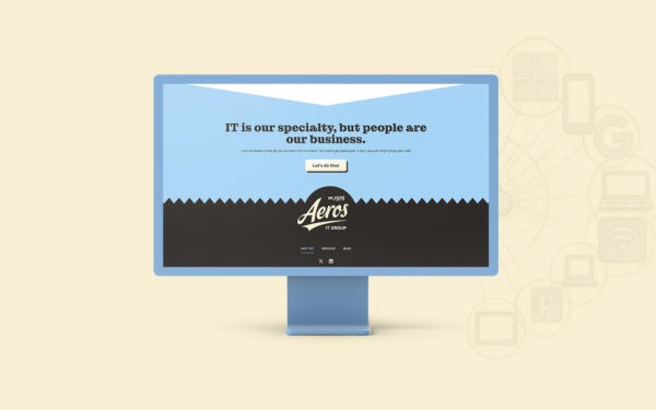 Mockup of Aeros IT Group’s website displayed on a desktop monitor, showing the homepage with the tagline 'IT is our specialty, but people are our business' over a blue and black design.