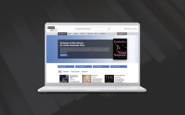 The image shows a laptop screen displaying the Duke University Press homepage, featuring the book Fantasies of Nina Simone by Jordan Alexander Stein. The banner highlights the book with a quote and a "More Info" button. The top navigation includes options to explore subjects, books, journals, societies, and more. Below, links to the "Current Catalog," "Join Our Mailing List," and "Customer Relations" are visible. A section at the bottom showcases book categories like "New," "Best Sellers," and "Featured Journals," with titles such as Daughter, Mother, Grandmother, and Whore and Blood Loss. The design is clean, with easy navigation and clear calls to action.