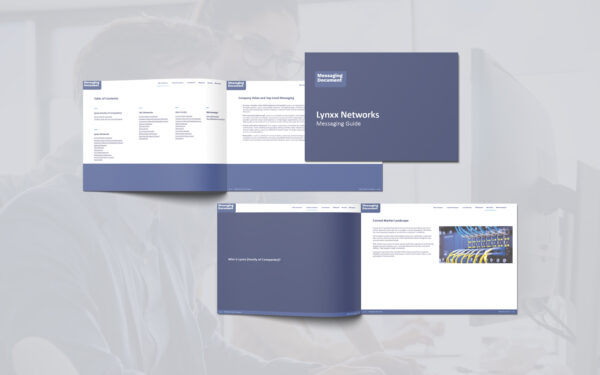 A composite visual showing the Lynxx Networks Messaging Guide mockups overlaid on a faded background photo of two coworkers viewing a desktop monitor. The brochure pages, including the cover, table of contents, and internal spreads, are prominently featured in the foreground, presenting a clean blue and white layout. The background adds professional context while maintaining focus on the document design.