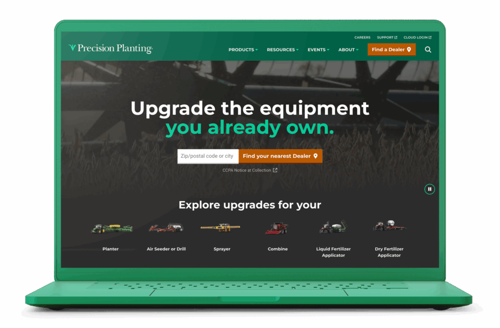 Precision Planting homepage on a laptop