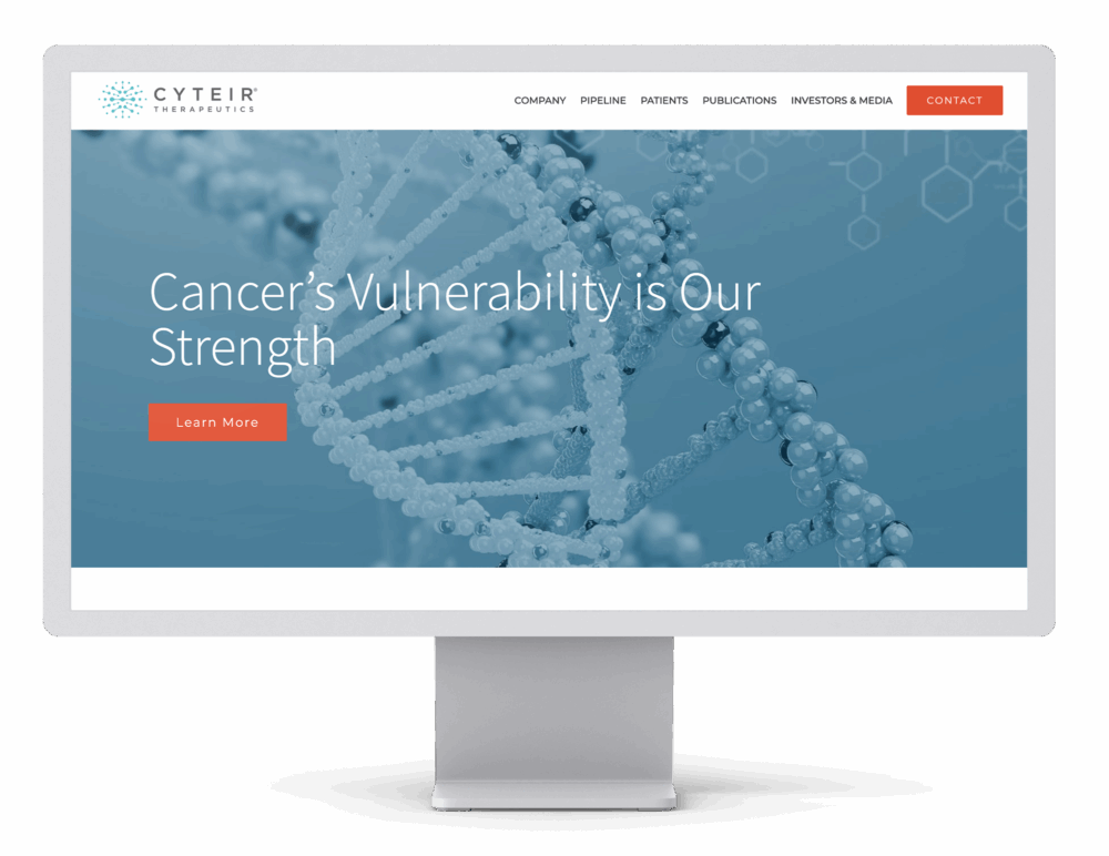 Computer monitor showing the Cyteir Therapeutics homepage with the headline “Innovators in DNA Repair” and a red “Learn More” button. The screen features a digital DNA strand and a navigation menu at the top.