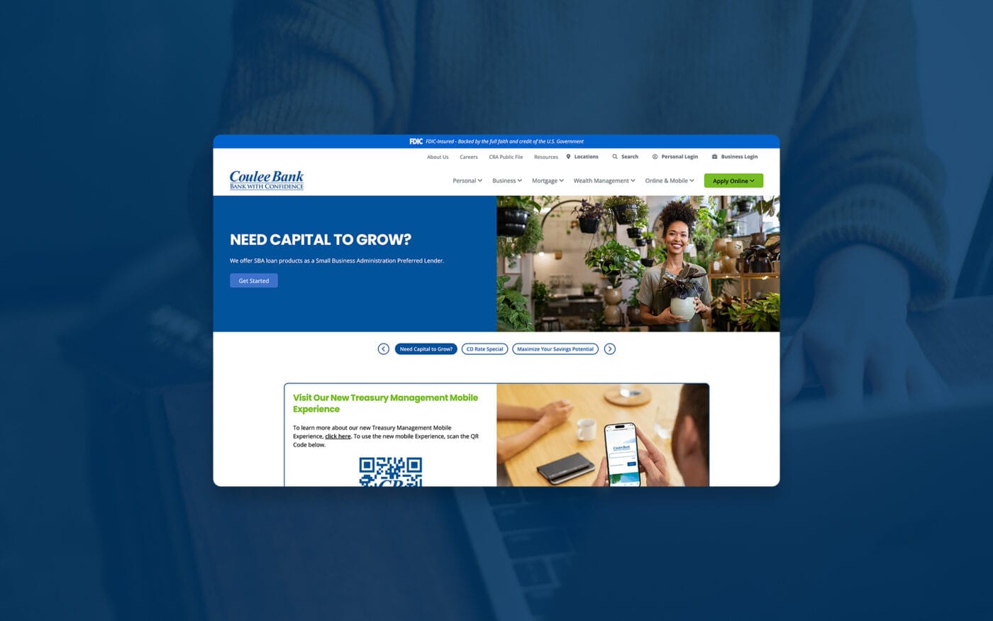 Full-screen view of Coulee Bank’s homepage overlaid on a blue-tinted background of a person using a laptop.
