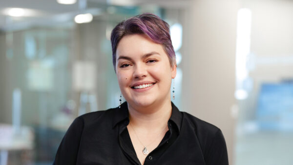 Alex Page standing in the BizStream office